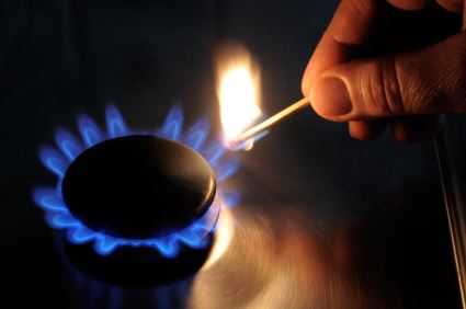 lit match next to open gas flame