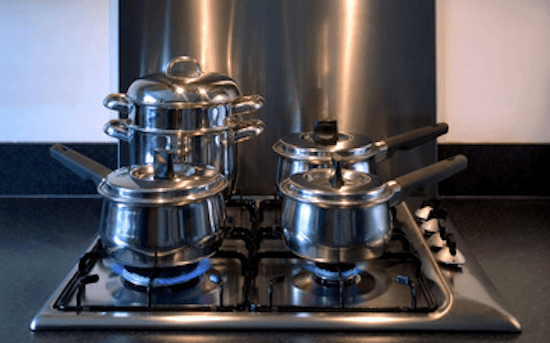 four pots on gas stove