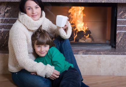 family in front of fireplace