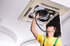 technician inspecting air ducts