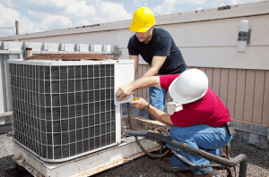 2 Technicians Repairing Commercial Air Conditioner