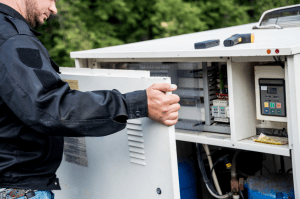 technician inspecting HVAC system