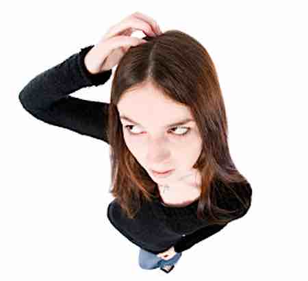 person scratching their head
