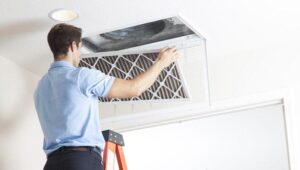 technician installing air filter