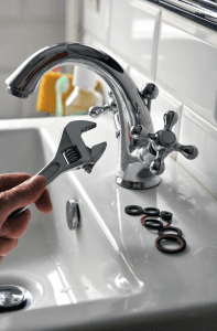 wrench repairing faucet