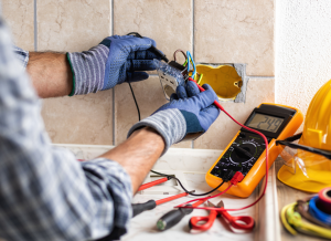 technician repairing outlet wiring
